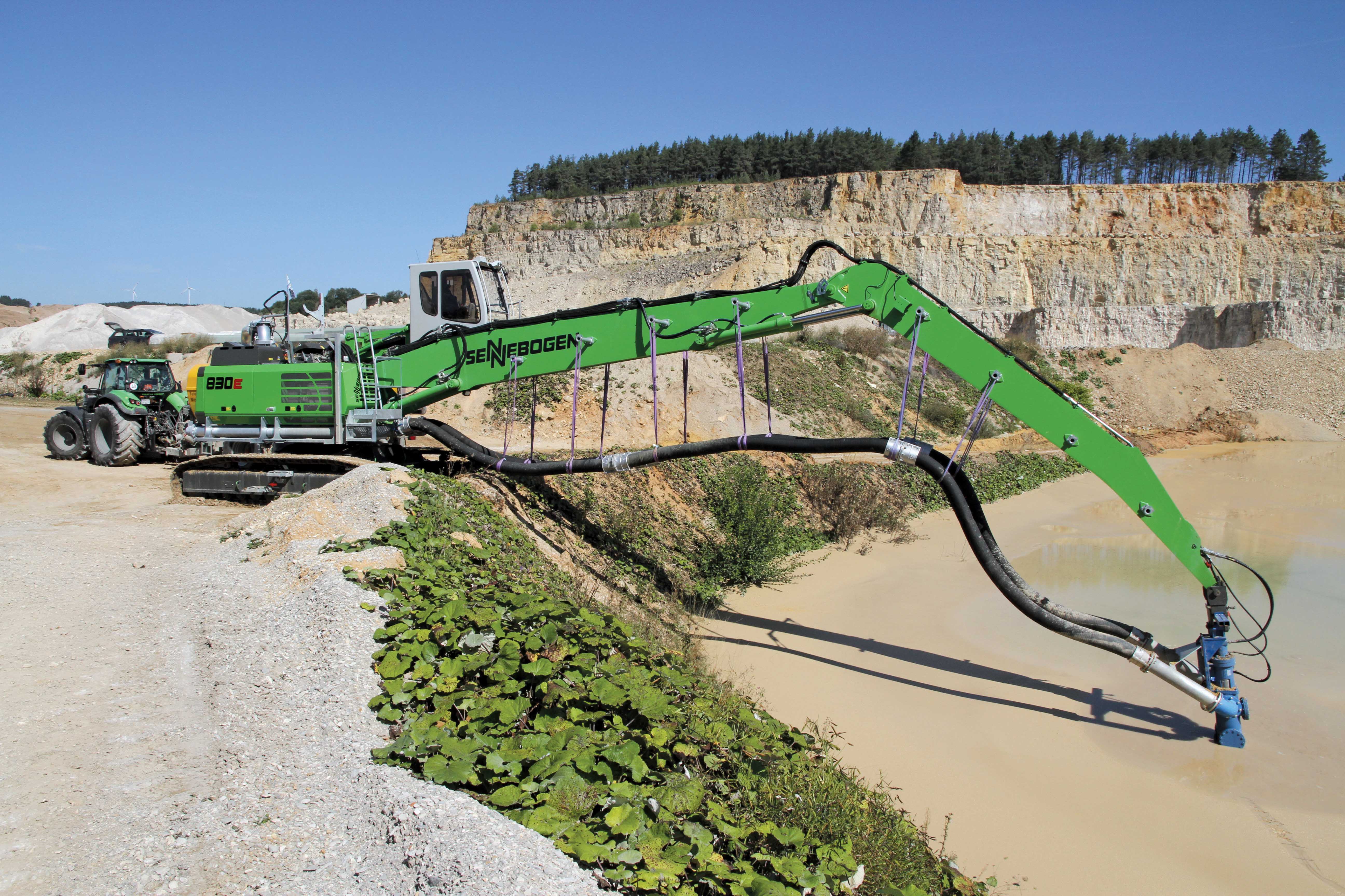 Sennebogen excavator pumping dolomite grit 