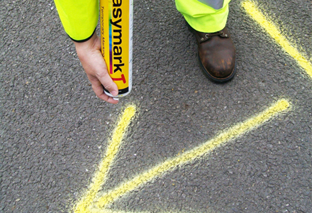 man using easymark spray