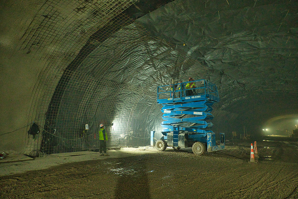 Access equipment is being used to assist with the meshing work prior to shotcreting the bored stretches 