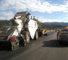 haulage trucks are dumping the mix in front of the MTV