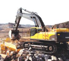 Volvo's excavator hauling rocks into dump track