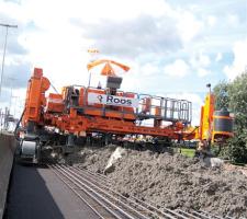 Crawler excavator behind the concrete