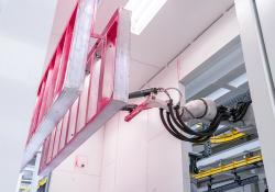 Automatic, digital and flexible: Doka’s new powder-coating plant selects the right powder application method, such as the robot hand,  to suit a client’s needs (image courtesy Doka)