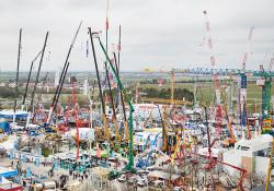 Once again, visitors to bauma in Munich, can look forward to the famous “crane forest” with more than 30 cranes towering above the crowds (image courtesy Messe München)