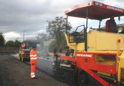 Paver working on road