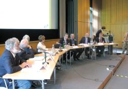 Panellists sitting at conference 