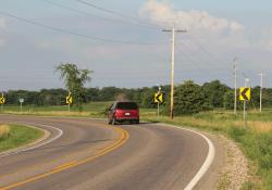 car going around a marked corner