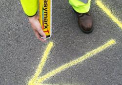 man using easymark spray