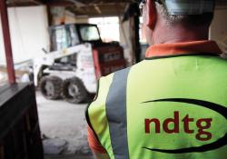 Skid steer loader operating on site