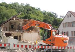 Doosan excavator demolishing a building