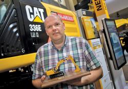 Caterpillar's new 336E H hydraulic hybrid excavator avatar