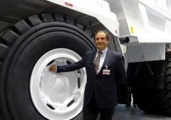 Dr Maurizio Perlini next to Perlini DP 705 WD dump truck 