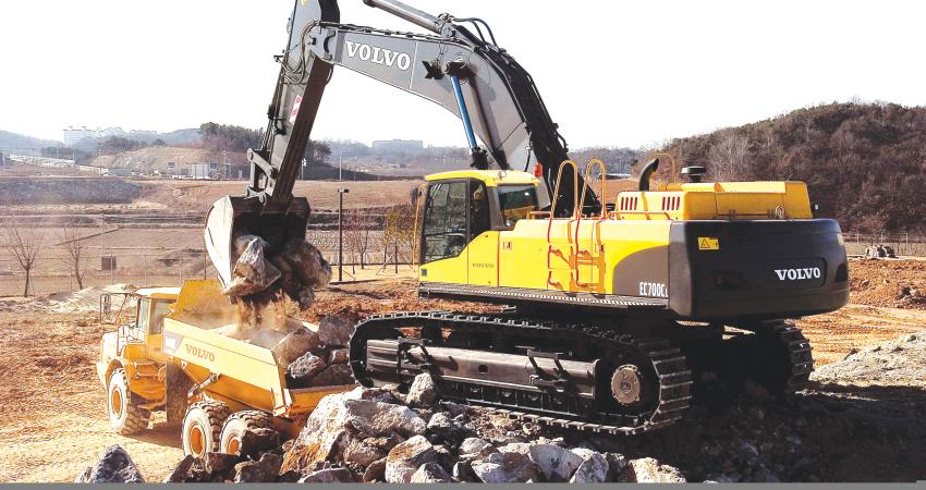 Volvo's excavator hauling rocks into dump track