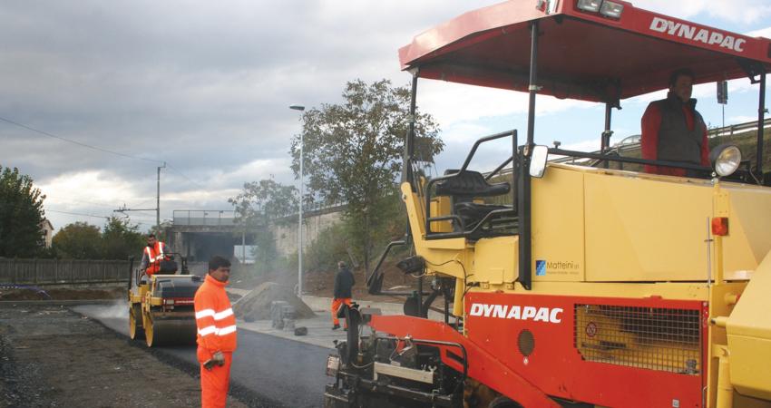 Paver working on road