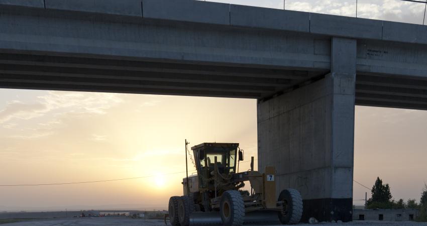 caterpillar machine in the sunset