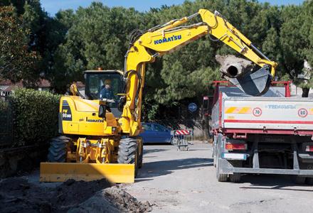 komatsu excavator filling truck