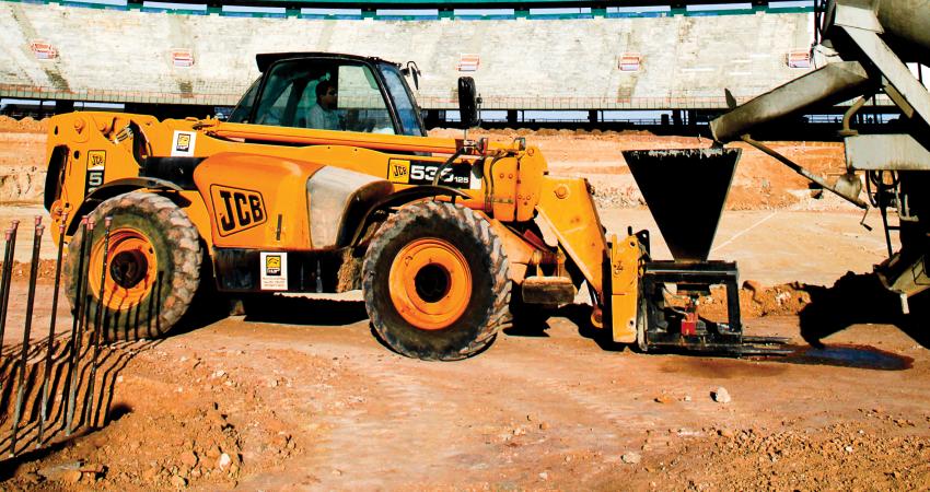 A JCB Loadall telescopic handler takes on concrete for the stadium refurbishment