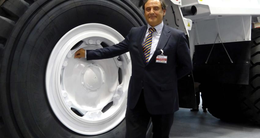 Dr Maurizio Perlini next to Perlini DP 705 WD dump truck 