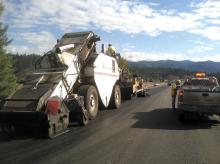 haulage trucks are dumping the mix in front of the MTV