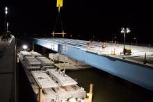 Concrete sections being placed on approach road girders