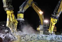 fleet of excavators fitted with hydraulic attachments 