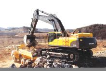 Volvo's excavator hauling rocks into dump track