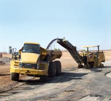 Caterpillar dump tuck being loaded up 