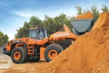 Doosan loader hauling sand