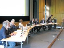 Panellists sitting at conference 