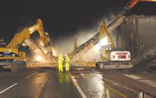 Powerful demolition tools removing the bridge 