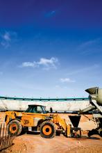 A JCB Loadall telescopic handler takes on concrete for the stadium refurbishment