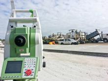 A steady flow of concrete into the paver Hunter Expressway