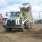 Man standing on Terex dump truck 