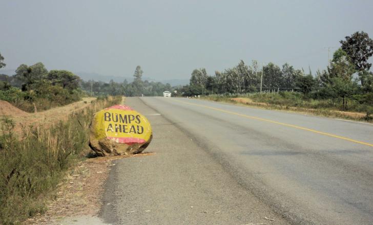 Rocky road warning sign